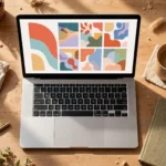Cozy home office desk with a laptop showing a colorful blog layout, coffee mug and notebook nearby