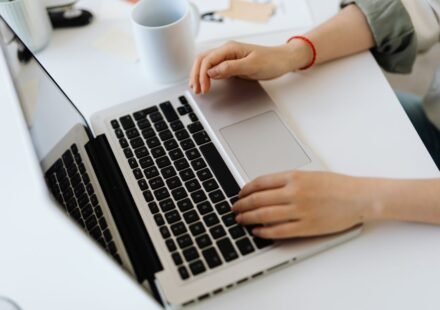 Person typing on a laptop while installing WordPress